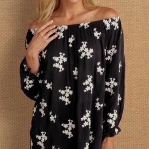 Soft Surroundings black top with off white floral stitch details. Elastic wrists